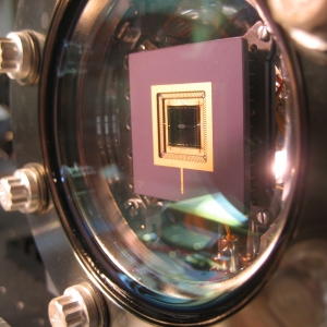 Ion trap mounted in a vacuum can